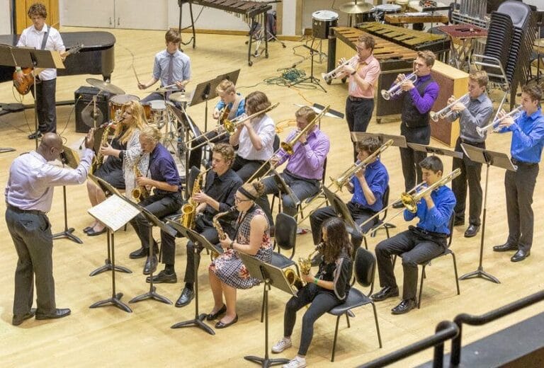 A small orchestra performing in a music hall
