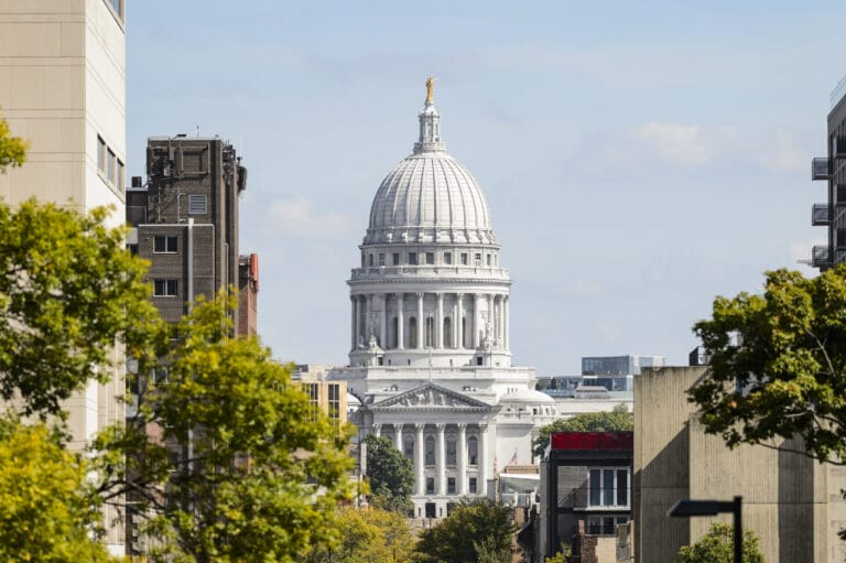 The dome of the Wisconsin State Capitol is seen in a view looking up State Street from Library Mall at the University of Wisconsin-Madison in autumn.
