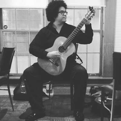 Leonardo Quintero playing his guitar