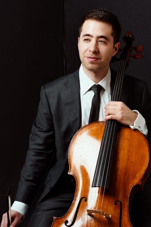 Zalkind holding his cello