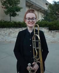 Jocelyn posing for a picture with her trumpet