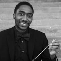 A conductor posing for a picture