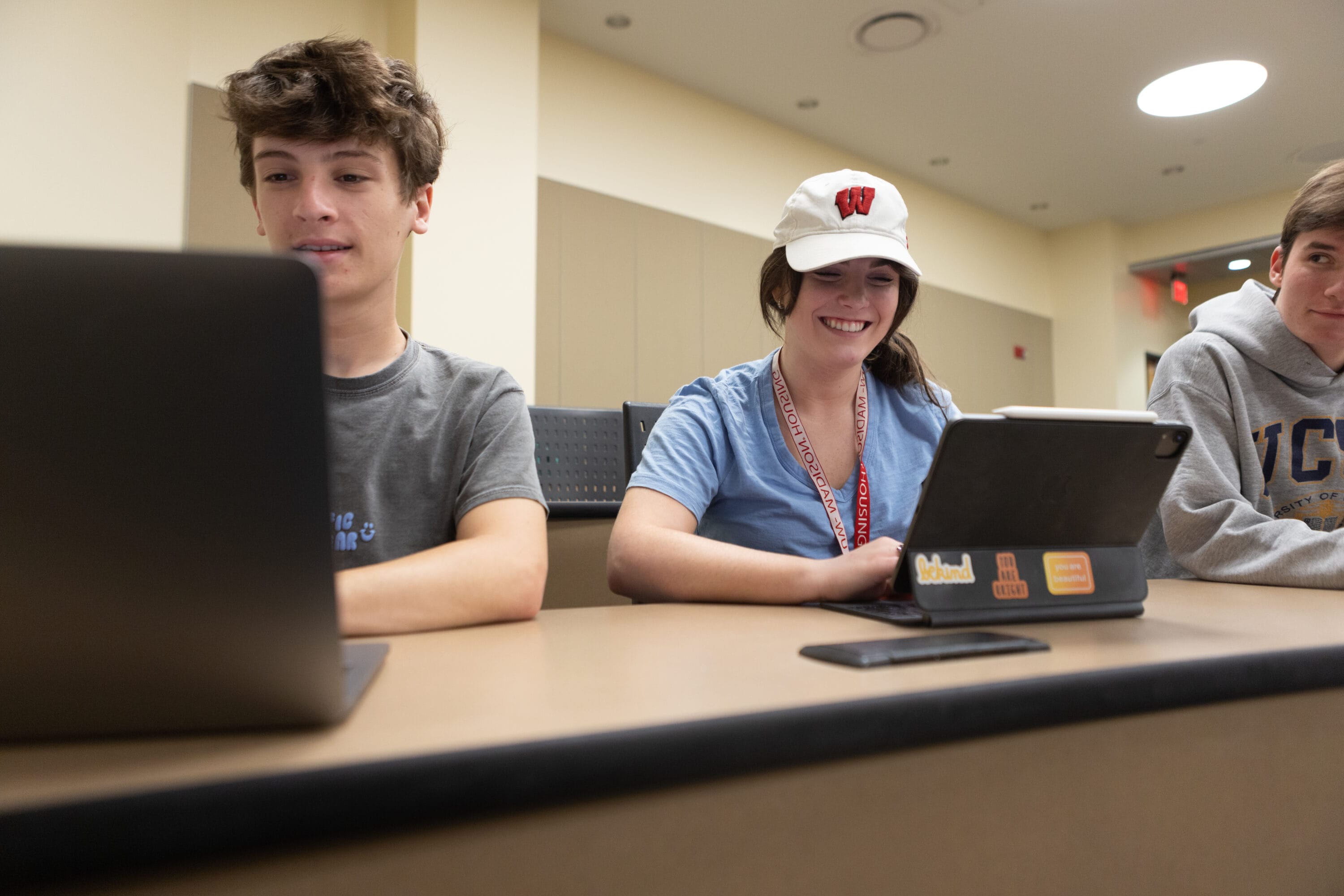 2 Badger Precollege accelerated learning program students on their computers.