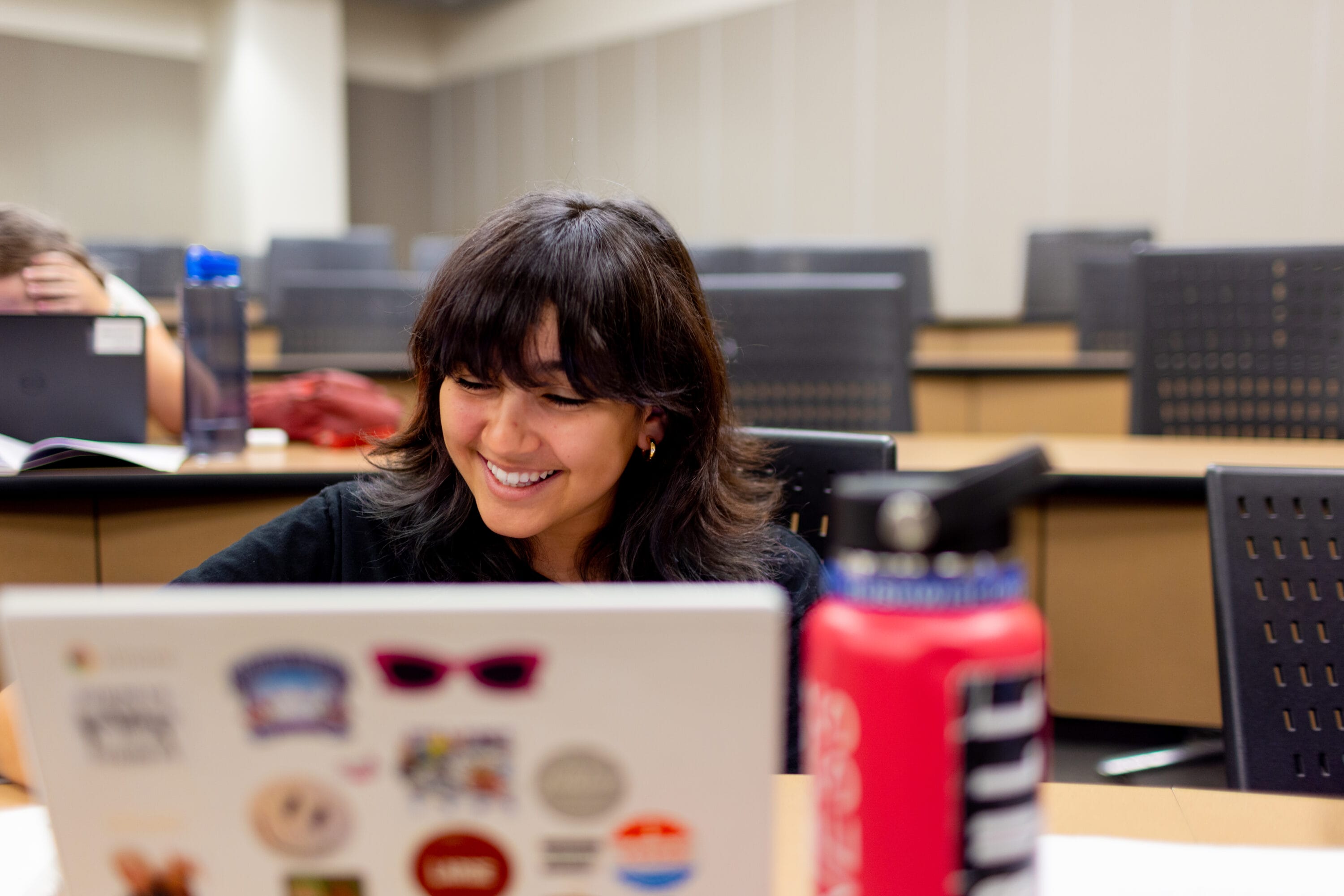 A student working on her laptop