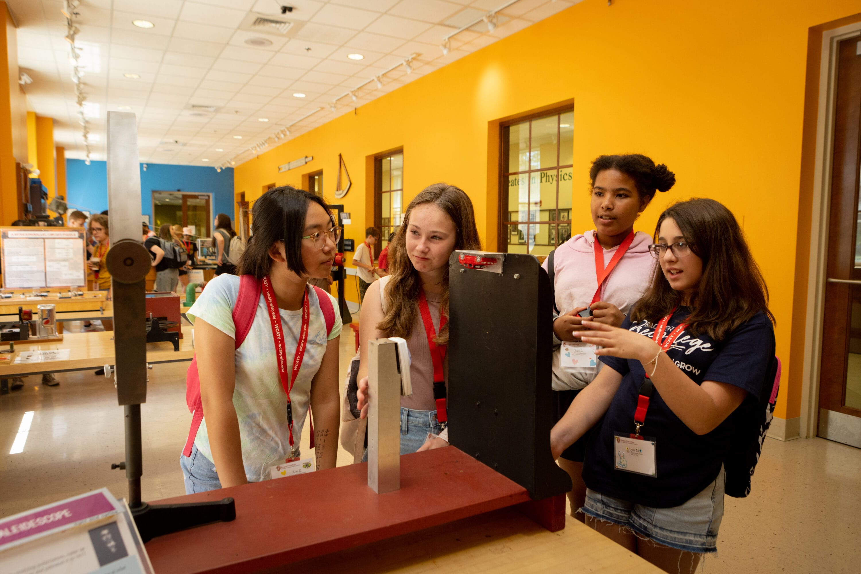 A group of GEM students observing a group project.