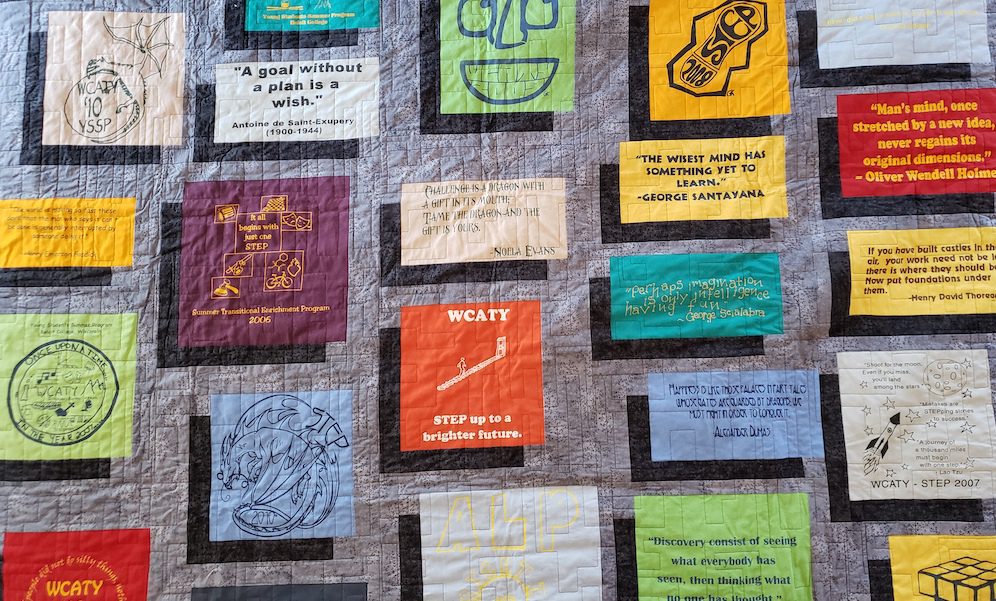 Colorful handmade quilt made from WCATY T-shirts