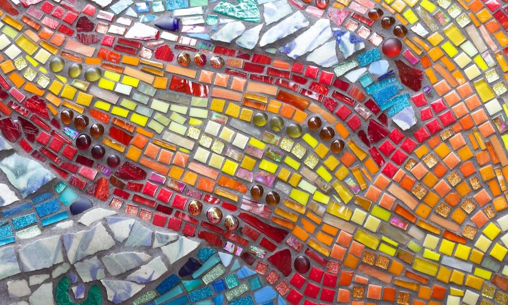 Colorful glass mosaic detail of a sun